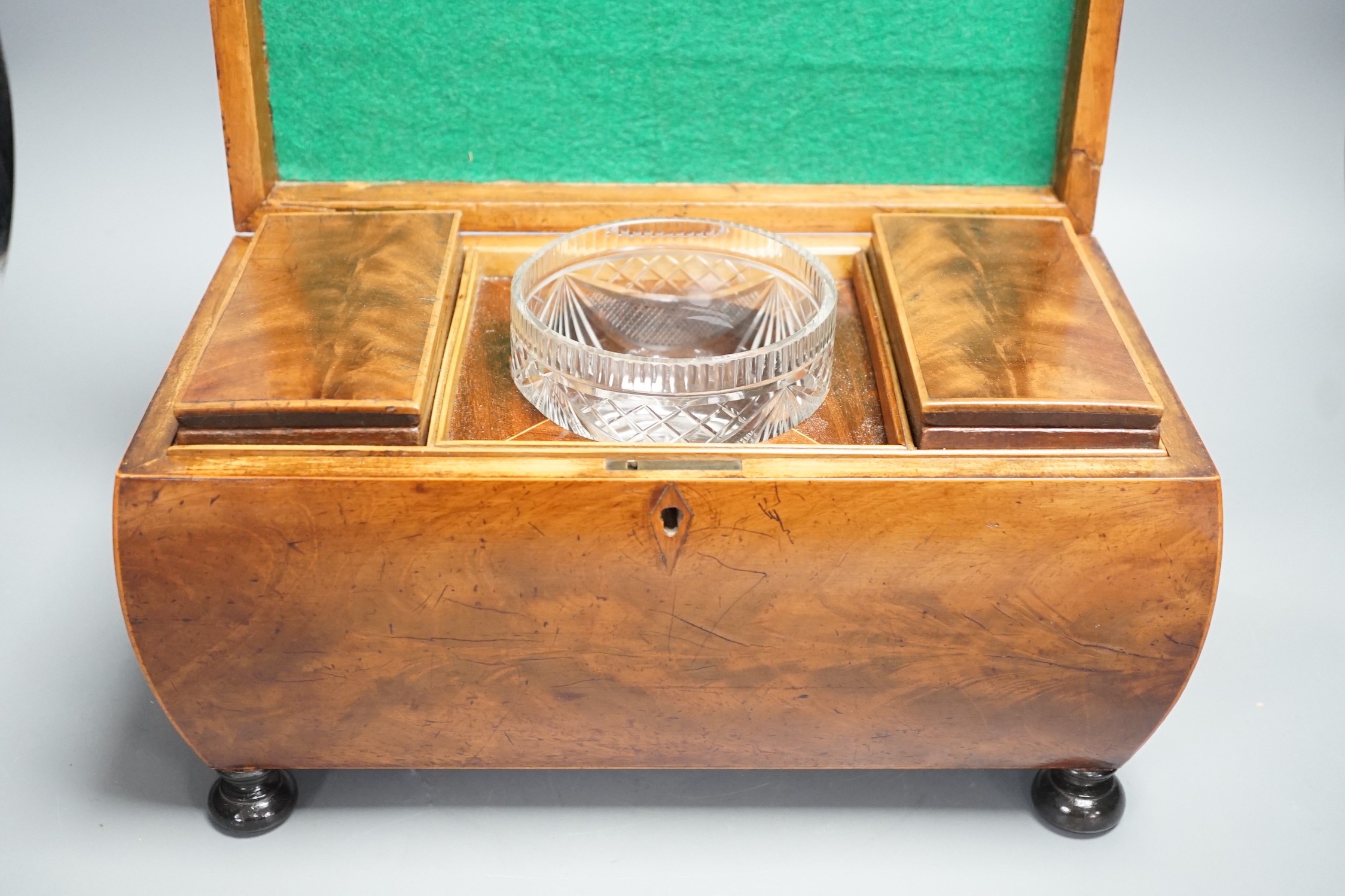A George IV mahogany bombe-shaped sarcophagus tea caddy, 33cms wide